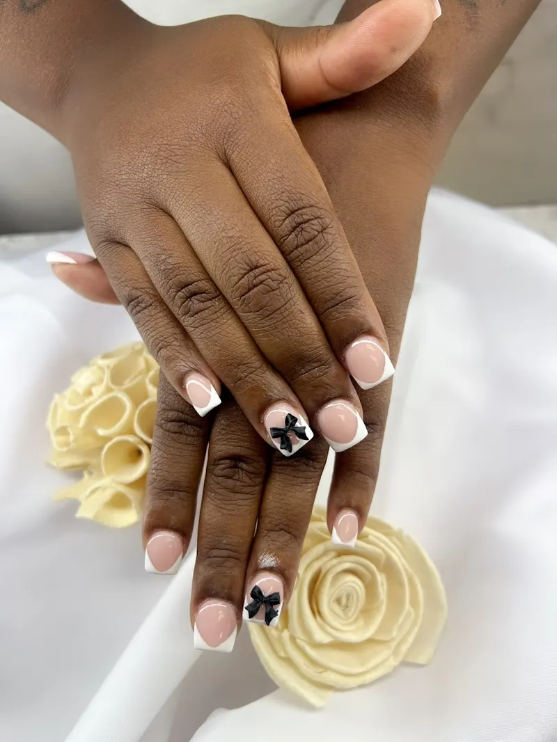 Neutral nails with a delicate hand-painted accent