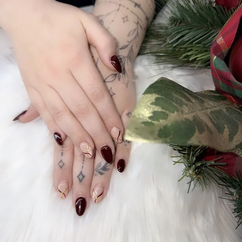 Rich burgundy nails with a high-shine finish