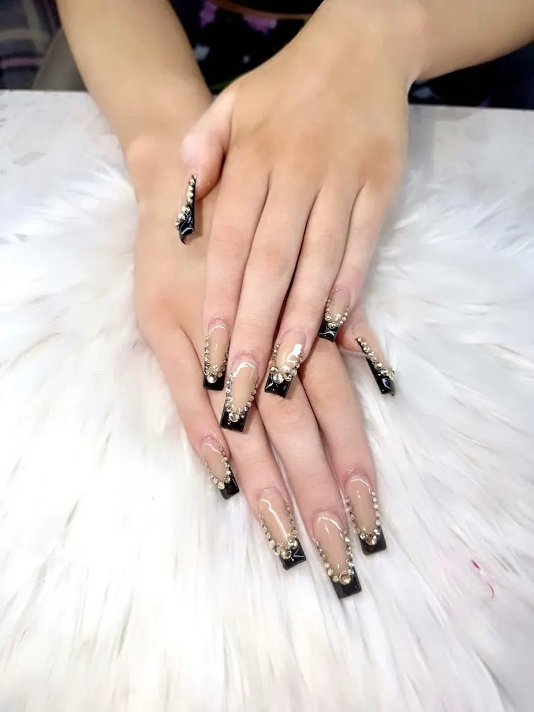 Black ombre nails on a soft white background