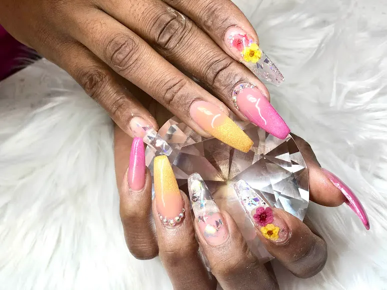 Pink and yellow 3D flower nails with sparkling crystal accents